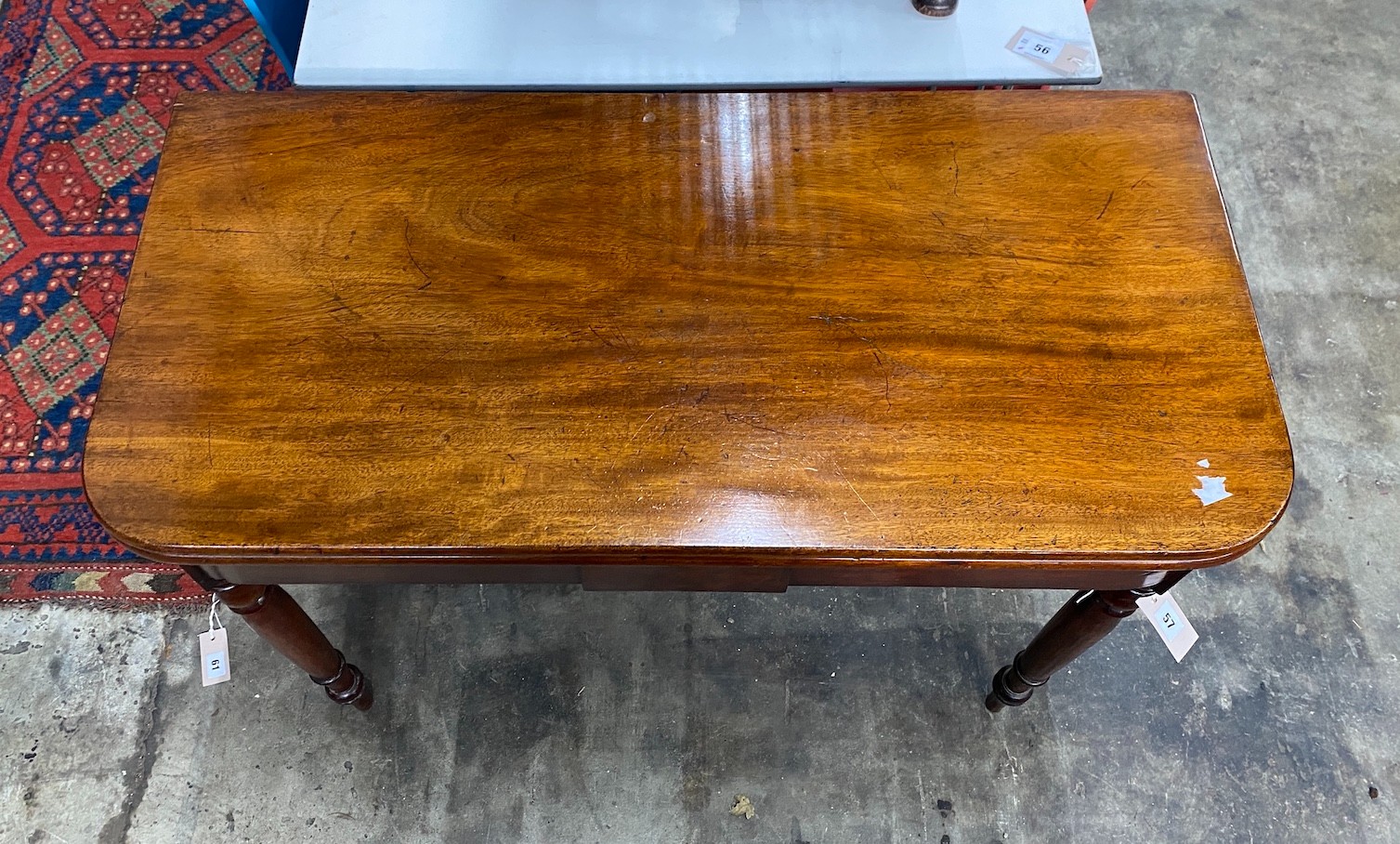 An early Victorian rectangular mahogany folding tea table, width 93cm, depth 44cm, height 75cm